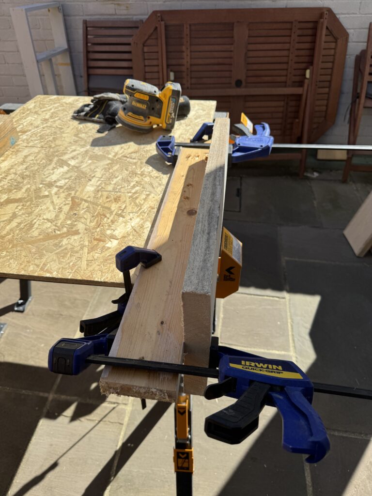 Using my saw horses as a vice during sanding.